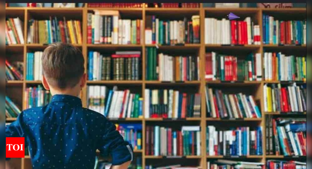 Optical Illusion: Can you find this little boy's umbrella in the library?